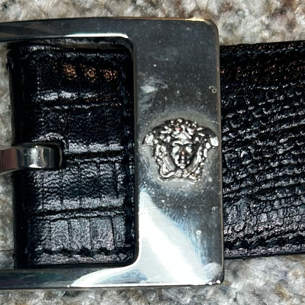 Vintage Gianni Versace black snakeskin belt with silver Medusa buckle.